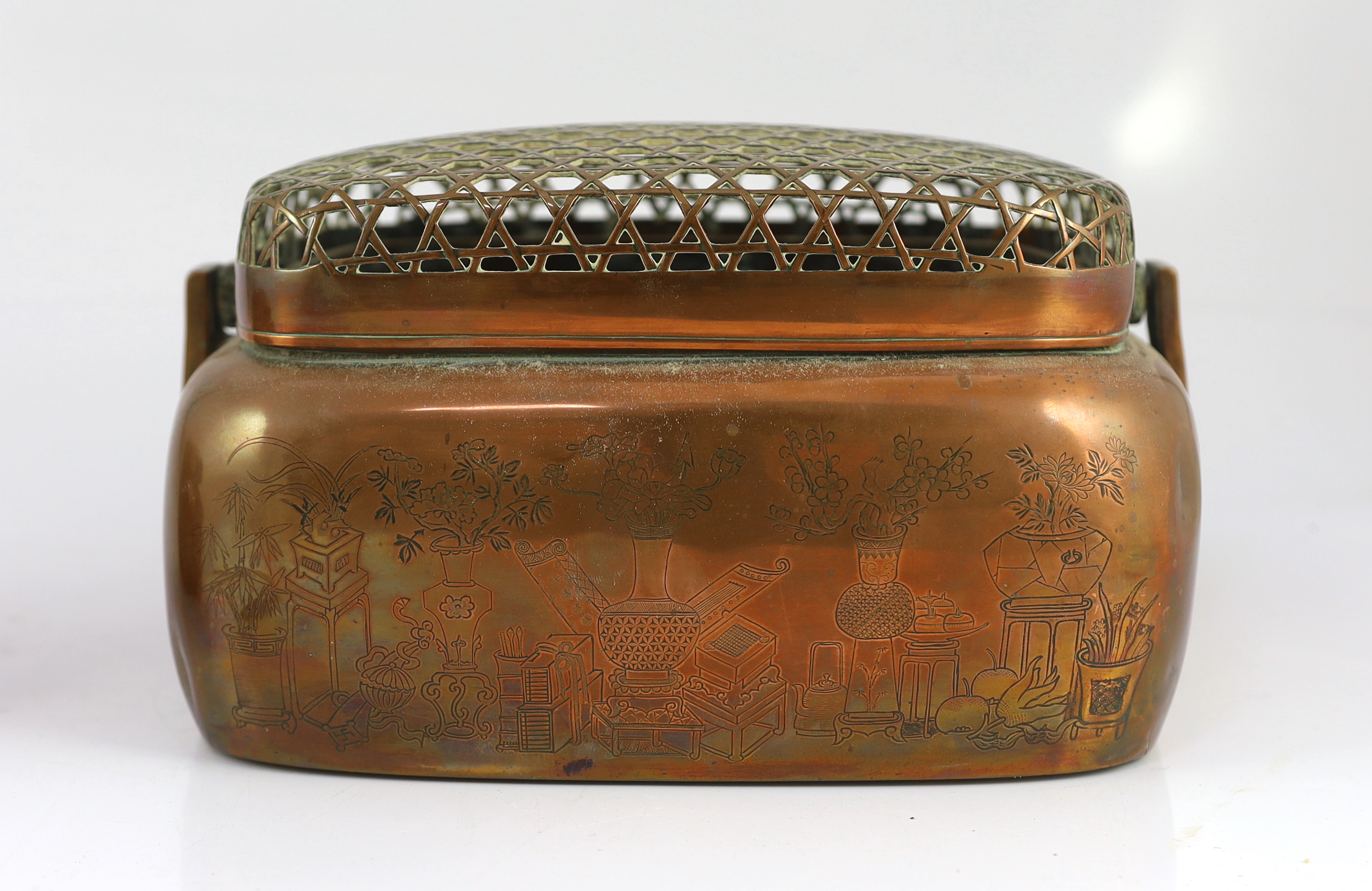 Two Chinese copper hand warmers, the largest signed ‘Zhang Mingqi', 18th/19th century